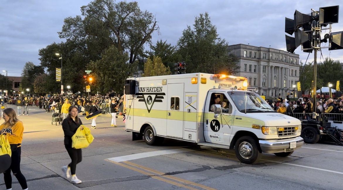 Vanbulance driving down the street in Iowa City for the 2023 Homecoming Parade