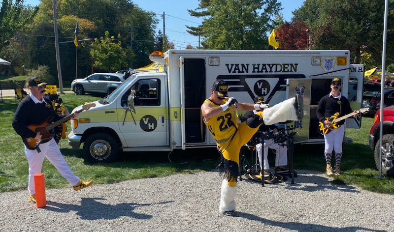 Van Hayden Band Performing at a tailgate in front of their Vanbulance