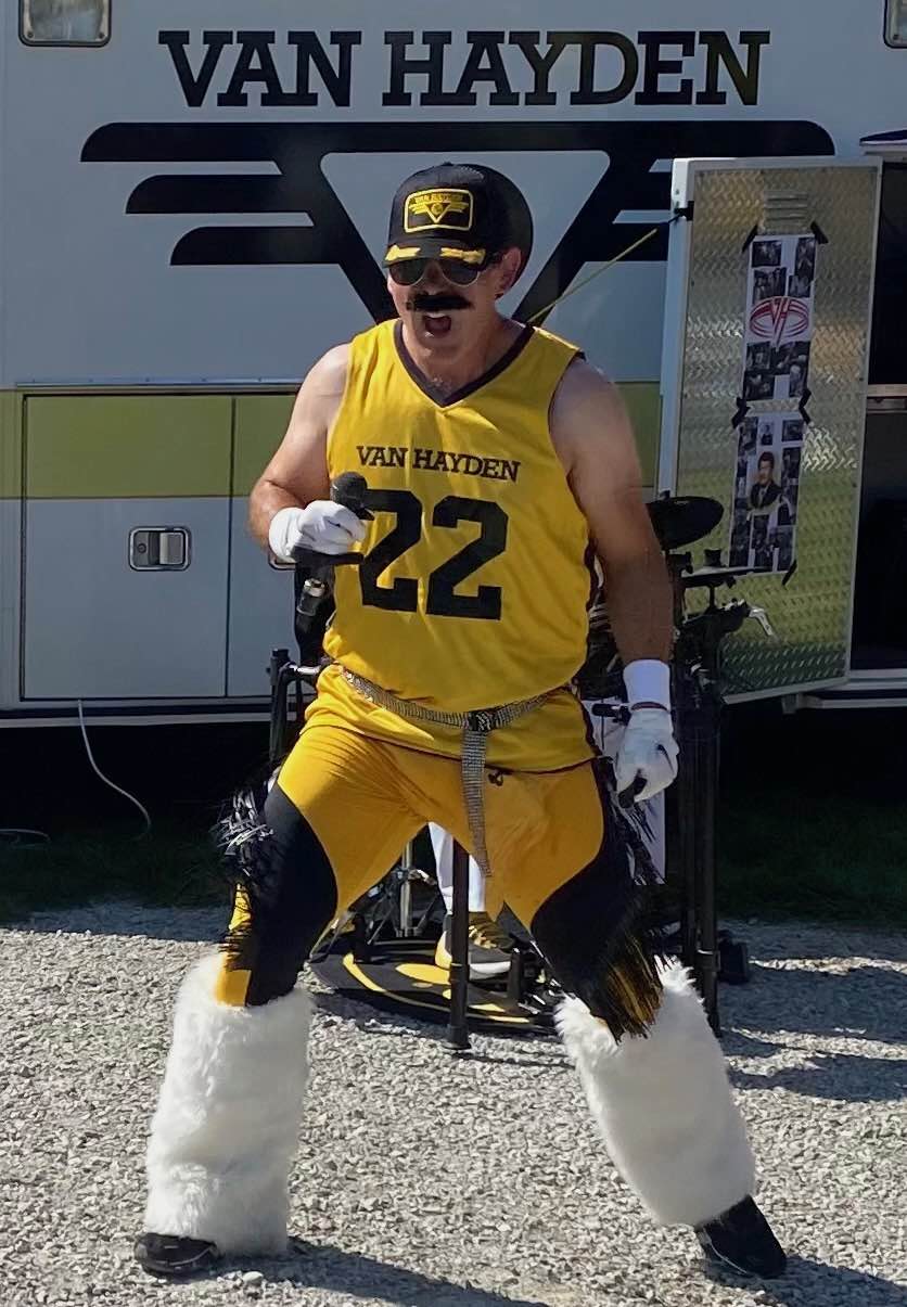 Hayden Lee Roth performing in front of the Vanbulance at a tailgate for the Iowa vs. Michigan State game