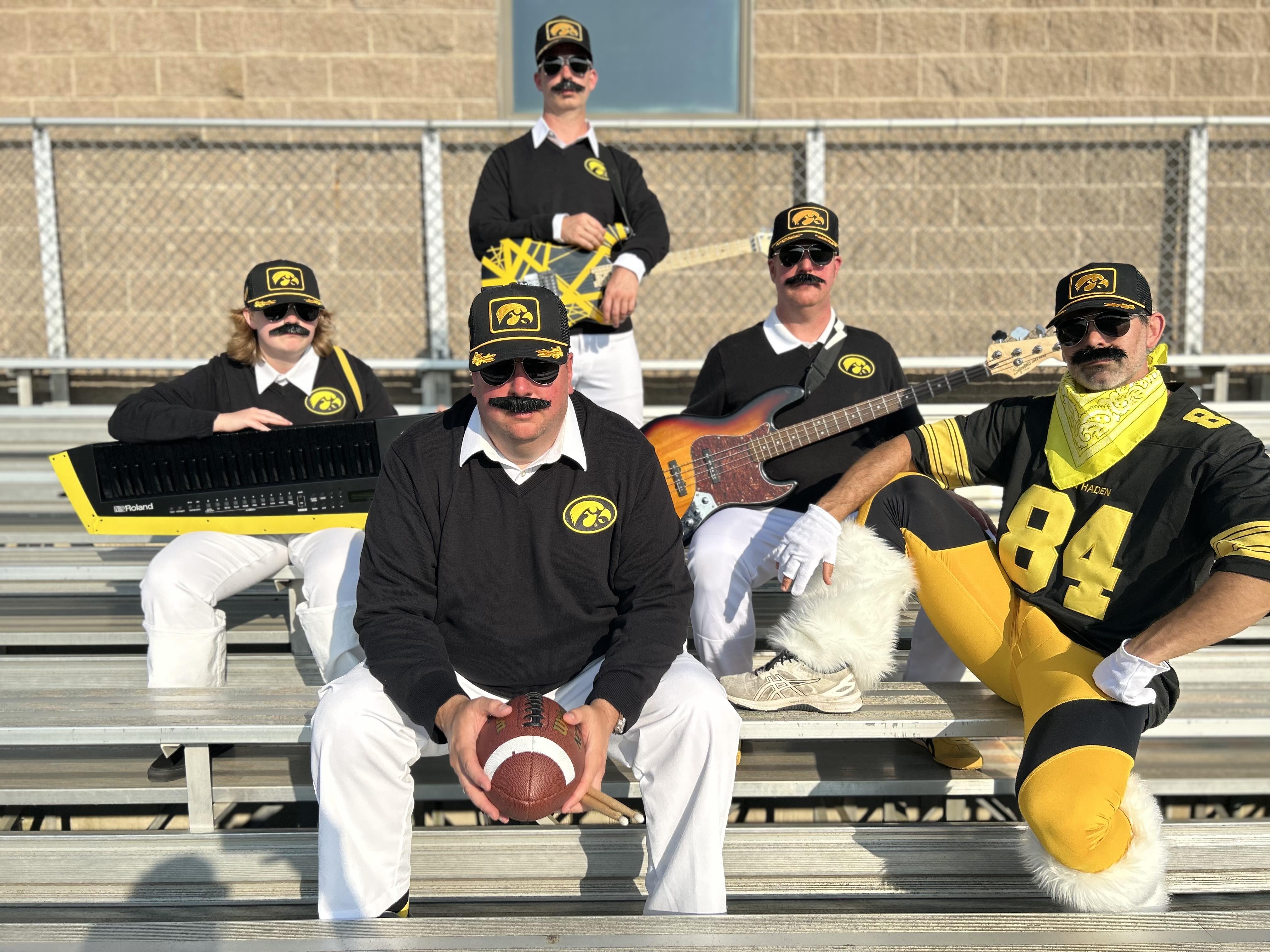 Van Hayden Band sitting on bleachers