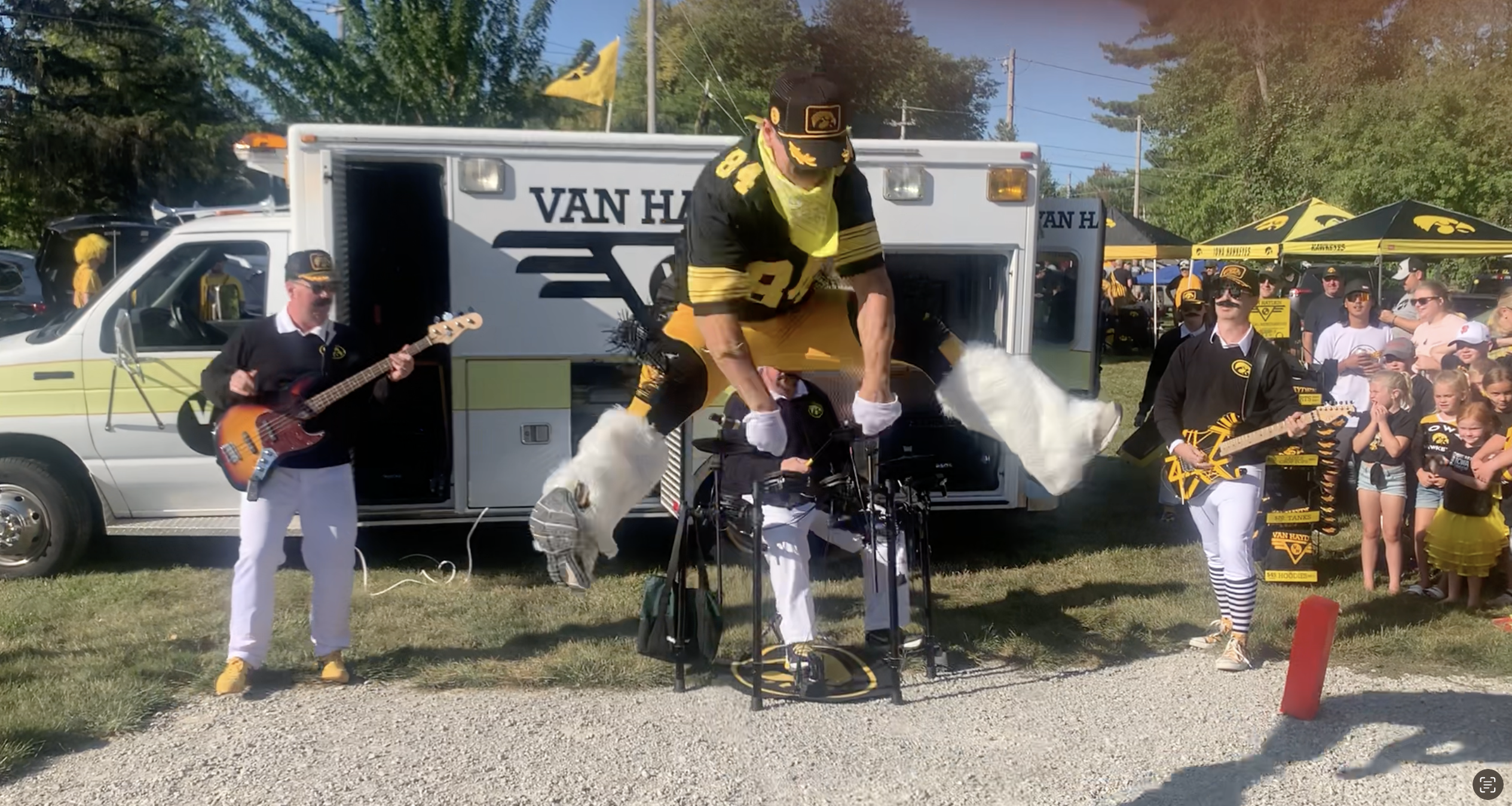 Van Hayden Band Performing at a tailgate in front of their Vanbulance at a tailgate for the Iowa vs. Utah State game